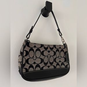 Coach, small shoulder or arm purse.